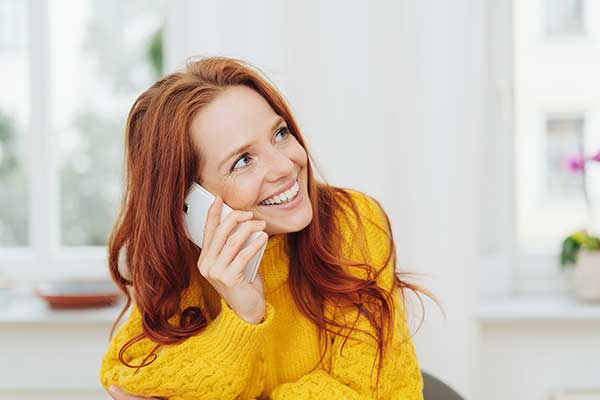 woman on phone with friend as self care