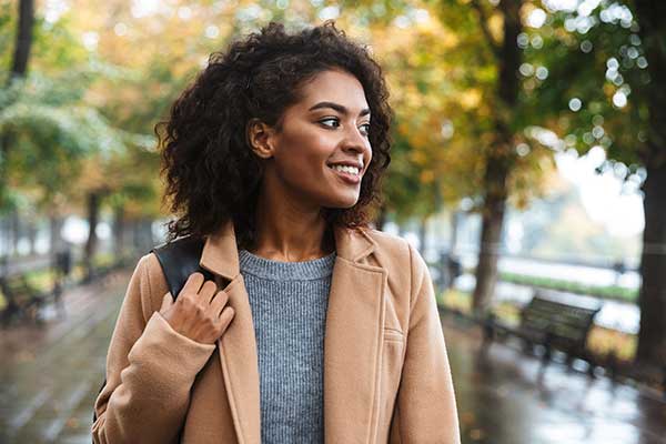 woman walking outside as a way to self care