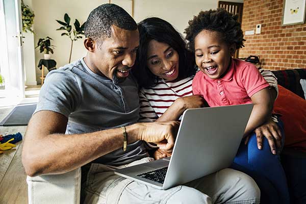 family with laptop computer