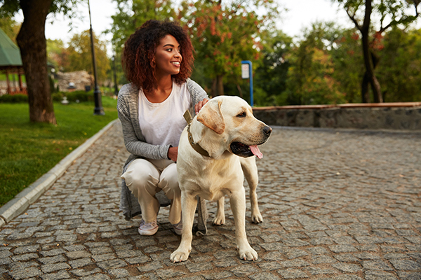 woman with dog at park