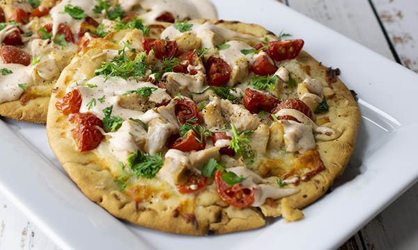 (Family Features) When dining outside with your loved ones, there are few things better than a tasty dish the whole family can enjoy. This Chipotle Chicken Flatbread makes for a perfect al fresco meal.